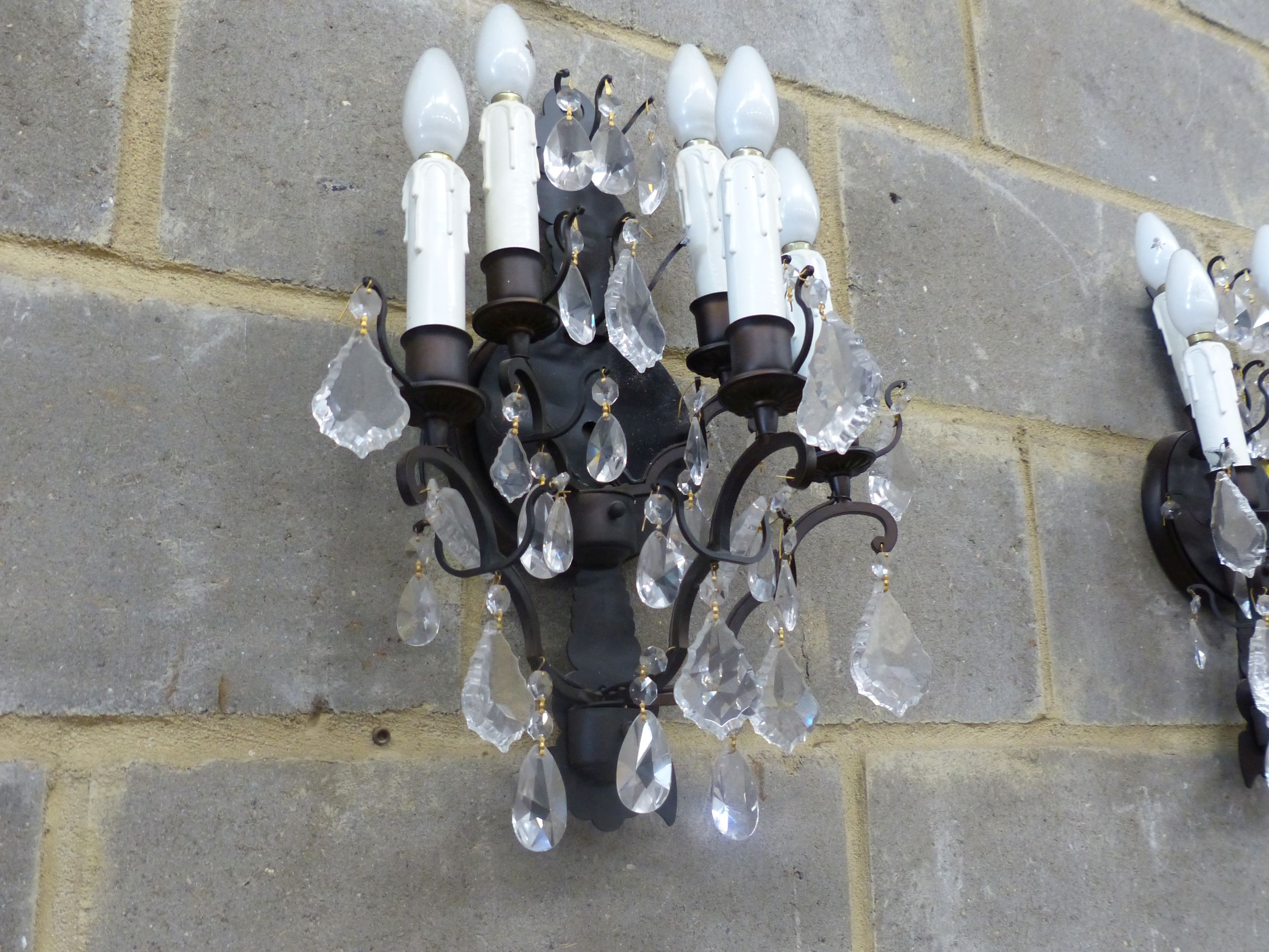 A set of six painted metal five branch wall lights, faceted glass drops, height 46cm